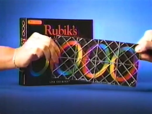 Everyone had a Rubik's Cube, but do you remember Rubik's Magic? Released in 1986, it was another handheld puzzle. I could never solve it, but if this commercial was any indication, neither could Macho Man Randy Savage. | Dinosaur Dracula