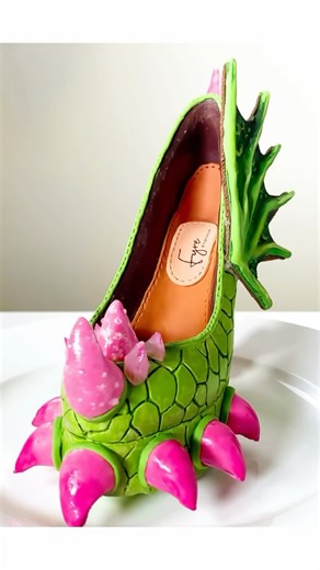 506K views · 1K reactions | A peek behind the scenes at the making of my dragon-inspired chocolate high heel shoe. She’s decorated with bonbon claws, kohakutou candy spikes and a chocolate cookie wing. I’m hoping to start on the next piece for this collection really soon and can’t wait to share the final design! 珞 #chocolateart #chocolatesculpture #footweardesign #designerfootwear #edibleart | Inspired to Taste | Facebook