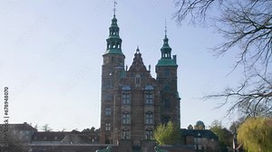 Rosenborg Castle towers against a clear blue sky in Copenhagen.
