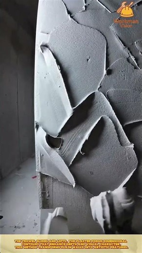 Skilled Worker Applying Decorative Plaster Texture on Wall Surface for Artistic Interior Finish