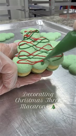 MACAMOCHI | Macarons, mochi, Dubai chocolate on Instagram: "Hand-decorating these little Christmas tree macarons in my cozy tiny bakery 🌲✨ Every detail is made by hand — gentle piping, tiny decorations, and a whole lot of holiday magic. Nothing makes me happier than creating festive treats that bring joy! 💚 #macarons #christmastreats #christmasmacarons #holidaybaking #bakerylife #smallbakery #cozyvibes #handmadebaking #festivevibes #sweettreats #homemadegoodness #christmasdesserts #bakerlife #