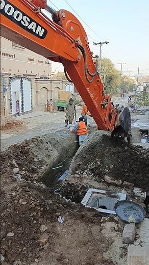 Construction 🚧 work in progress excavator dig and repair underground utilities on a busy street 🚧