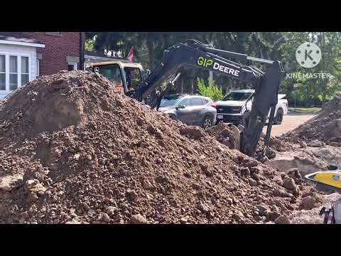 Cat 420F backhoe loader and John deere excavator working