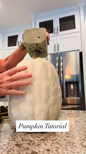 Let’s make something cute for your front porch, Fall decor! It’s super easy and you can of course use a mixture of different stems. Start by pushing a piece of floral foam down on the stem of your pumpkin. Then just start adding your flowers. You can use wire cutters if the stems need to be cut down. That’s all there is to it! Now you have a cute little arrangement for your front porch. | Home On Pine Lane