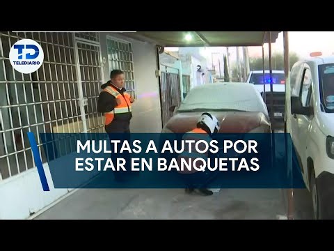 Realizan multas a carros estacionados en banquetas