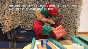 12 hats of Christmas… an elf hat! This elf has some very handy tips for cutting and wrappinng with ease. | Active Hands