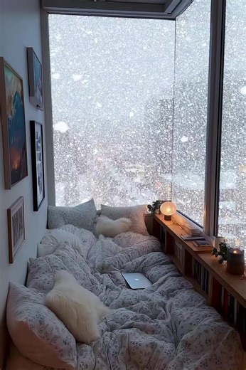 Cozy Winter Dreams: The Ultimate Snowy Window View Goal ❄️🏠 ​Experience the peak of winter aesthetic with this cozy nook. ☕✨ This snowy city view is the perfect vibe for relaxation and deep work. Tag someone who needs this setup! ​#wintervibes #cozyathome #aesthetic #interiordesign #Peacefulvibes