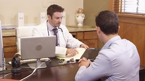 Doctor showing patient an xray