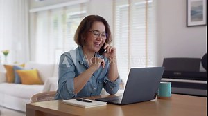 Asia healthy elder people, SME owner lady or latin telesale service agent manager answer cellphone call via 5G wifi wireless relax sit at home office desk with smile humor laugh client care job.