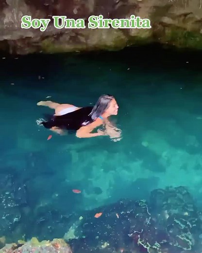 Swimming in a Serene Natural Cave Pool