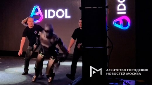 Russian AI robot falls onstage during debut