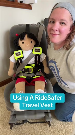 Here’s how to buckle up in a RideSafer Travel Vest! The RideSafer Travel Vest is a legal and safe child restraint that is available commercially in the USA and by prescription in Canada. It positions the seatbelt on a child’s body, while offering the additional restraint of a top tether and a crotch belt to discourage the child from slouching. It can be used for travel/carpool or everyday use to help make a tight 3-across happen or to help safely restrain a very young child who has outgrown a ha
