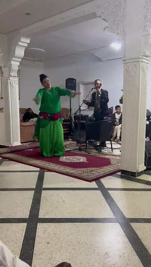 Traditional Dance Performance in Elegant Green Dress