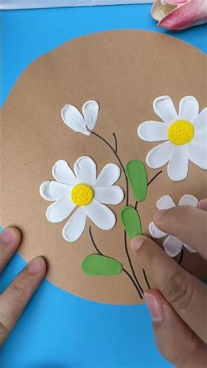 Make a beautiful spring-themed painting with clay! Invite your kids to try it together!