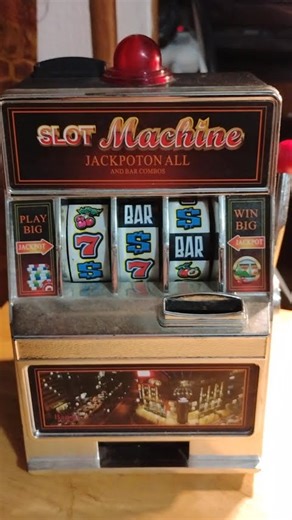 I found a small miniature slot machine and I'm going to try to win!