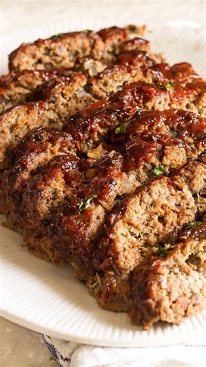Recipe Name: Classic Glazed Meatloaf Ingredients 1. 2 lbs ground beef 2. 1 cup breadcrumbs 3. 2 eggs 4. 1 small onion, finely diced 5. 3 cloves garlic, minced 6. 1/3 cup milk 7. 2 tbsp Worcestershire sauce 8. 1 tsp salt 9. 1 tsp black pepper 10. 1 tsp Italian seasoning 11. 1/2 cup ketchup 12. 2 tbsp brown sugar 13. 1 tbsp Dijon mustard Recipe 1. Preheat oven to 375°F (190°C). 2. Grease a loaf pan or line a baking sheet with parchment paper. 3. In a large bowl combine ground beef, breadcrumbs, eg