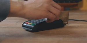 Credit card processing fees: Who should pay them?