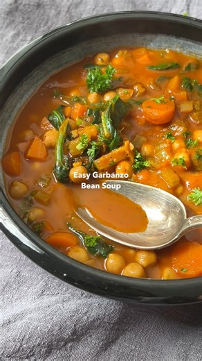 Comment BEAN SOUP and I’ll dm the recipe to you! 👇🏽 Garbanzo bean soup (chickpea soup) with vegetables is made from inexpensive kitchen basics, ready in 40 minutes, and loaded with nutritious fiber, protein, and nutrients! It’s gluten-free, vegan, & can be made using a stove, Instant Pot, or Crockpot! ✨ Recipe here: https://plantbasedonabudget.com/easy-garbanzo-bean-soup-stove-instant-pot-crockpot/ | Plant-Based on a Budget