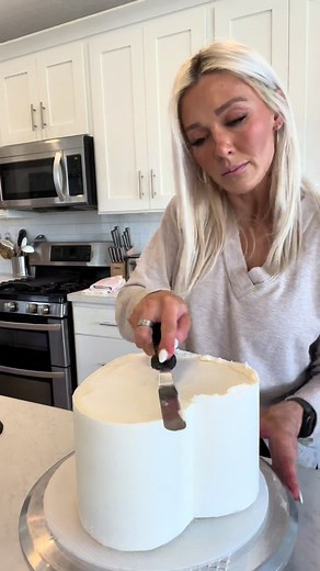 Part 2: Making a Heart Shaped Cake Piping Tips used: Wilton 4B, 21, 103. I used my Vanilla American Buttercream for the exterior of the cake, as well as all of the piping details. #theblondewhobakes #cakes #cake #cakedecorating #food #foodie #heart #heartcake #frosting #piping #howto #cakevideo #learnontikok #cakesoftiktok #tiktokpartner