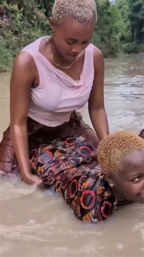 The girls were having fun bathing in the river! 😂🌊 #Shorts #Africa #Viral