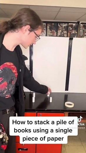 STACKING A PILE OF BOOKS USING A SINGLE PIECE OF PAPER