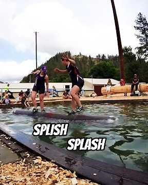 Women going head to head in a log rolling competition