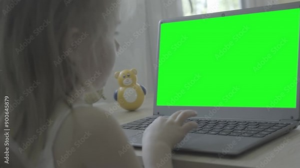 green screen display for video, smart 5-year-old child uses computer, primary school student front laptop, doing homework, Back to school concept, cyber safety, parental control technologies