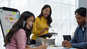 Asia business group meeting and discussing new startup concept projects Business team planning, strategic analysis, and brainstorming with office paper reports.