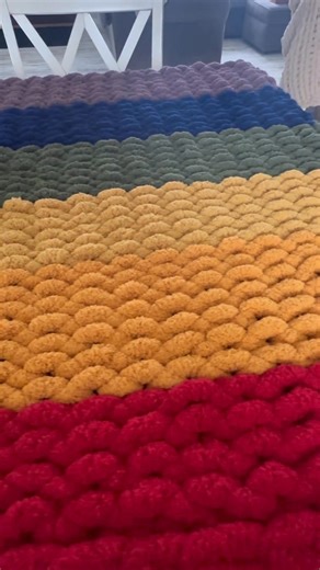 85K views · 1.1K reactions | A Single Garter Stitch on the loom 臨Dimensions: 40” x 38” and it’s about an Inch and a half thick! This stitch definitely eats up the yarn and makes a very thick blanket. Colors used (all hobby lobby) - 1 of each color; Red, Dearest Merigold, Mustard, Olive, Navy and French Lilac. This size would make a perfect Lapgan or a baby mat. I love how perfect it turned out. | Heather McCloskey | Facebook