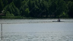 Canoeing competition training coaching workout a outrigger canoe boat sport. Single rowing of men in large water