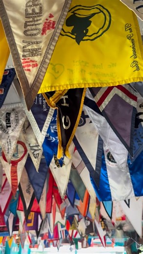 Did you know… The term “burgee” likely comes from the French word “bourgeois,” meaning “owner of a ship.” Starting in the 19th century, Burgees were initially used to identify vessels and their home clubs, fostering a sense of community among sailors. 🚩 We 🩵 all of the burgees, shirts and flags that have graced our walls and ceiling over the years! #scyc #stanielcay #exumaislands #stanielcayyachtclub #exumasbahamas | Staniel Cay Yacht Club
