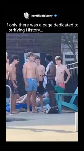 Horrifying History on Instagram: "The video captures a chaotic and intense fight that breaks out among a large group of young men at a swimming pool. The altercation begins abruptly when one young man, wearing dark shorts, throws punches at another, leading to a quick escalation. He is immediately swarmed by multiple other men, with a shocked bystander’s audio commentary noting that he is “one against seven.” Despite being heavily outnumbered, the young man continues to fight, delivering several