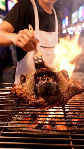 exploring street food selling grilled monkey meat