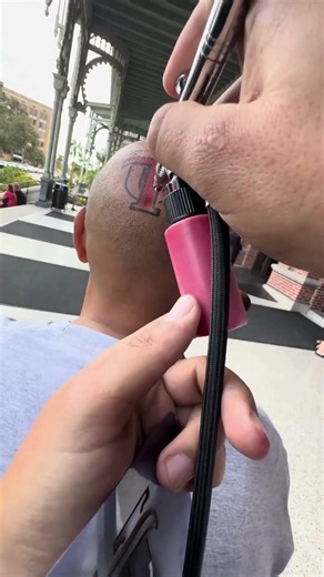 Airbrushing a Logo Tattoo on a Head?!