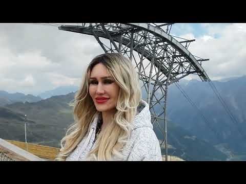 Granate styling, walking in the Alps, Tyrol, very nice panorama, skin tight pants, thigh high boots