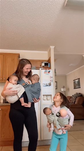 Natalie Chhom on Instagram: "My heart is SO full today. I wore my twins for the first time when they were 11 days old. My daughter has been completely enthralled by wearing babies. She was worn as a baby. She watched me wear her 2yr and 3yr old brothers as babies/toddlers. And she’s watched me wear her twin sisters for the last 6 months. She loves to help me put my babies in carriers. She has asked me to make makeshift carriers for twins out of swaddles. I’m so happy that she finally has her car