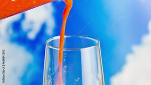 Refreshing Nectar: Close-Up of Freshly Blended Fruit Juice Pouring into a Glass, Rendered in Crisp 4K Resolution Stock Video