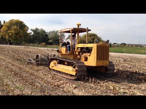 Old Cat D6 pulling an antique subsoiler.