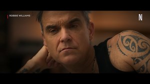 Let us (if you don’t mind) entertain you! Here’s your first look at the brand new four-part Robbie Williams documentary. Coming to Netflix later this year… | Netflix