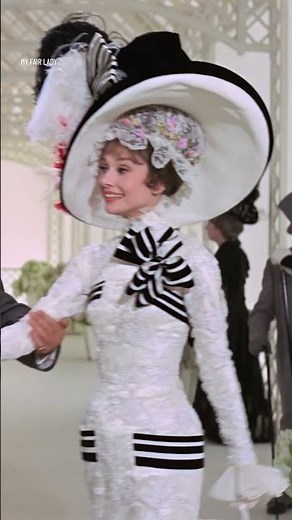Audrey Hepburn as Eliza Dolittle in My Fair Lady (1964) showing us all how to wear costume art.
