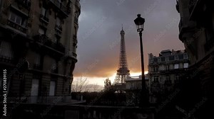 Eiffel tower in a cloudy orange sky with an old Parisian lamp post in the foreground in Paris during the summer. Haussmanian buildings, trees, 16th. Wide shot 4K.