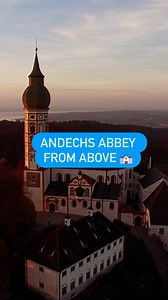 Explore the Bavarian Andechs Abbey from above. Founded in 1455 by Benedectine monks, this iconic monastery is renowned for its Baroque church, sacred relics, and centuries-old brewing tradition. #andechs #andechsabbey #monastery #travelbavaria #dwtravel | DW Travel