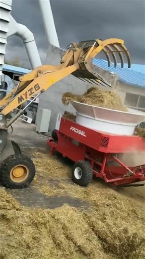 Tub grinder machine working on grass