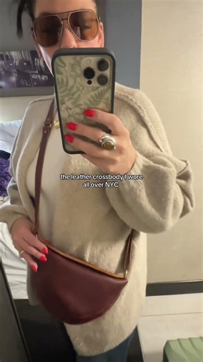 Genuine leather, hands-free, and actually holds everything… this crossbody did not miss in NYC🍎