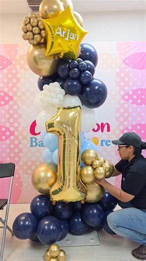 Watch step-by-step how to create this stunning, professional balloon column tower for a 1st birthday