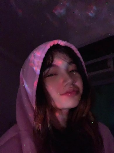 Cozy Pink Hooded Garment with Starry Light Background