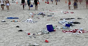 July 4th crowds on Dennis beach leave piles of trash behind