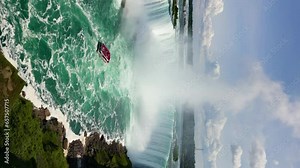 Aerial view of Niagara Falls, USA. A beautiful landscape of a river whose water falls down from a rock on the border of states. High quality 4k footage