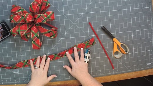 Who's adding bows to their gifts this year??? Check out this tutorial to learn how to make a SINGLE ribbon bow for your gift wrapping this year. | DecoExchange