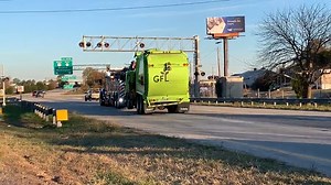 5.2K views · 26 reactions | The green DOT sign, which hangs over the road, and the pedestrian bridge were damaged, while the GFL truck has extensive damage to the container area: https://wcti12.com/news/local/garbage-truck-collides-with-pedestrian-bridge-and-dot-sign-causing-traffic-delays-on-highway-70-west | WCTI News 12 | Facebook